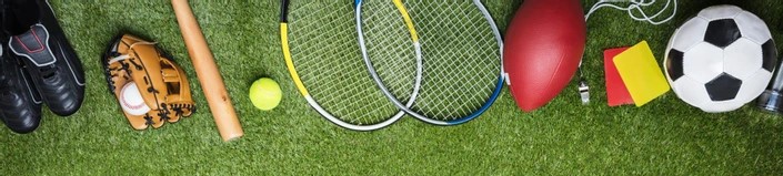 Image of sports equipment laid out on grass