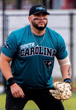 TJ Bourgoin in a baseball jersey with a baseball glove